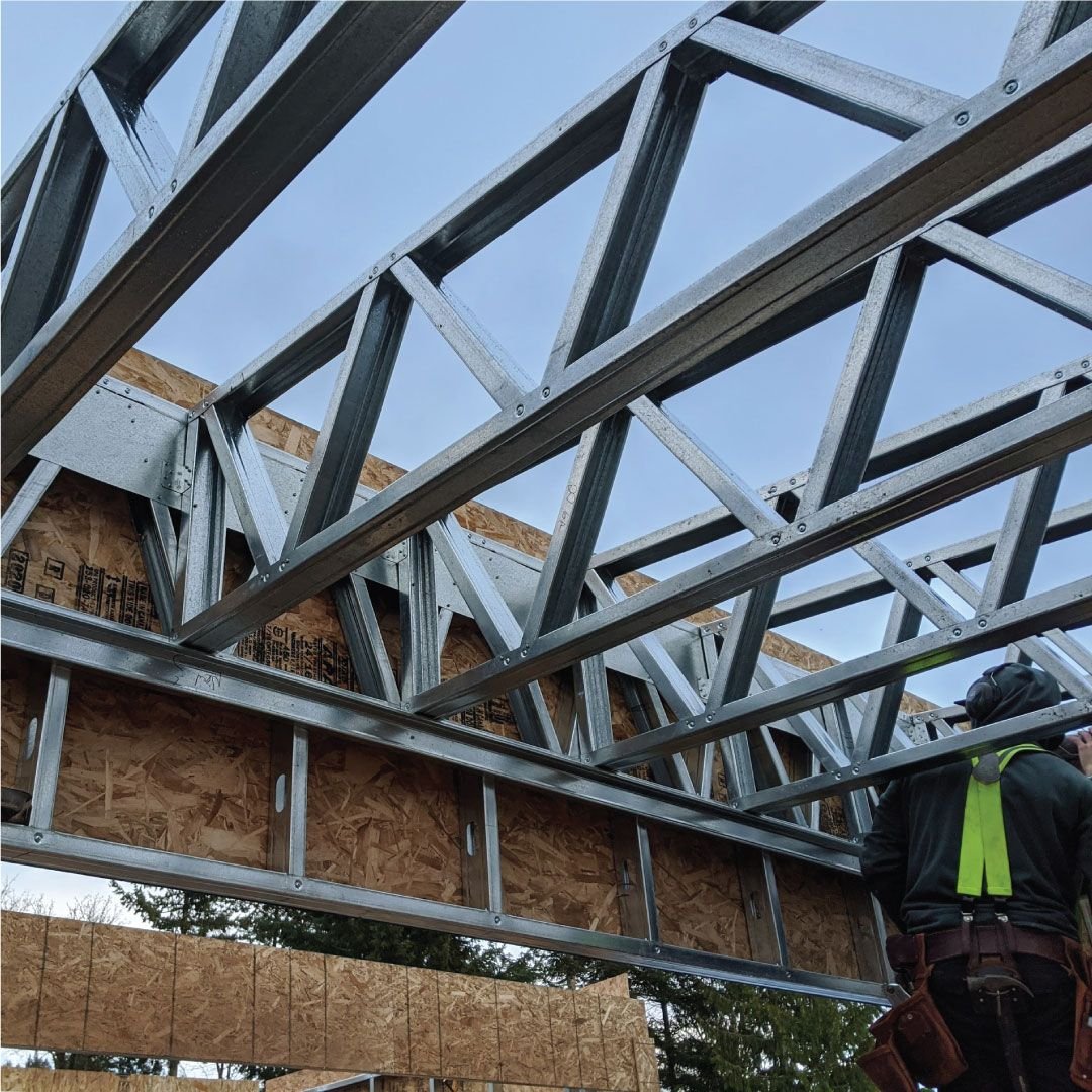 Steel roof trusses during installation